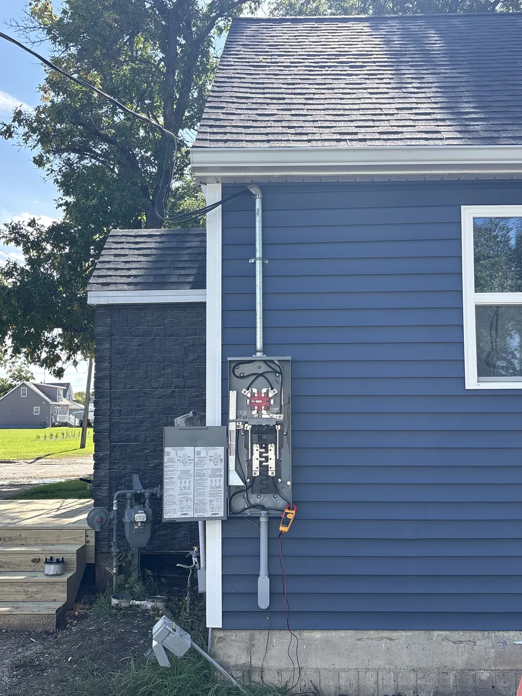New outdoor meter-main combination panel with the cover off during testing, before the meter was set, in Grygla, Minnesota